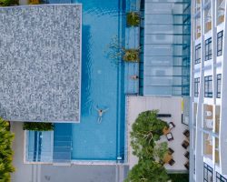 drone-view-from-above-at-swimming-pool-couple-men-2023-11-27-04-55-04-utc.jpg
